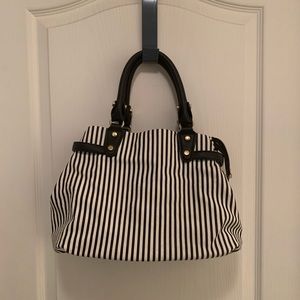 Black $ white vertical strip shoulder bag. Gold accents